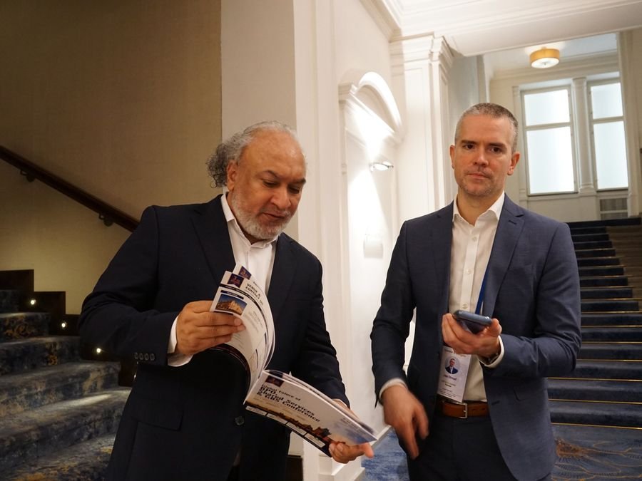 Reading the conference brochure at Hotel KINGS COURT, Prague, 2026 edition of the Global Future of BPO, Shared Services & GBS Conference