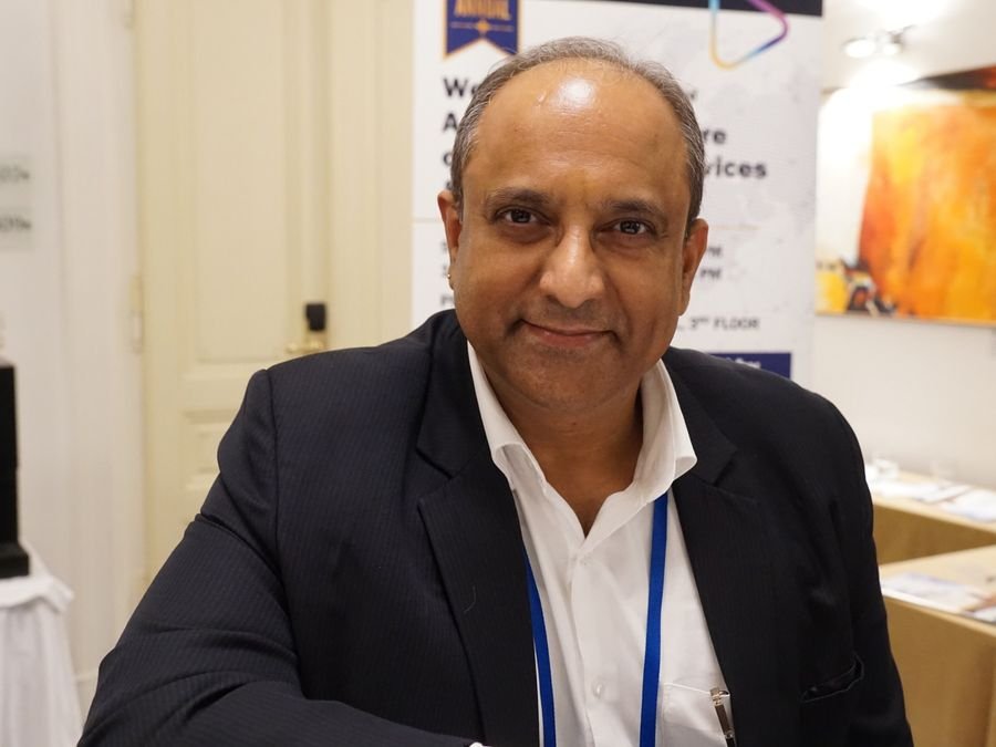 A delegate at the welcome banner at Hotel KINGS COURT, Prague, 2026 edition of the Global Future of BPO, Shared Services & GBS Conference