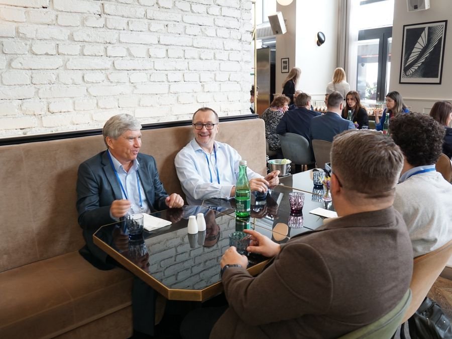 Delegates laughing over lunch at the hotel restaurant at Hotel KINGS COURT, Prague, 2026 edition of the Global Future of BPO, Shared Services & GBS Conference
