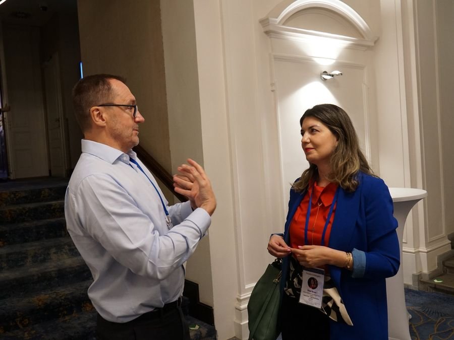 A conversation by the staircase between sessions at Hotel KINGS COURT, Prague, 2026 edition of the Global Future of BPO, Shared Services & GBS Conference