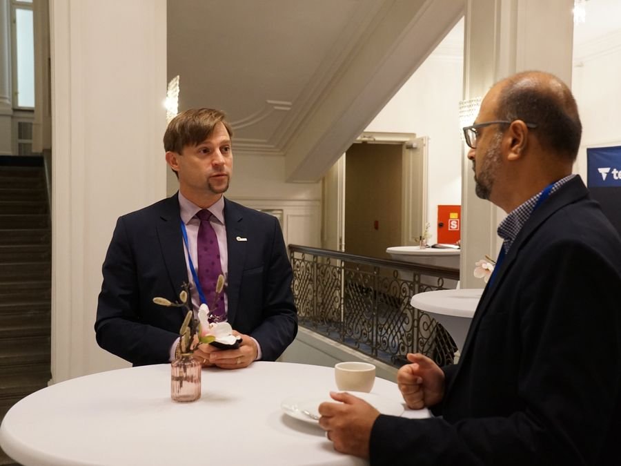 Two delegates talking at a standing table at Hotel KINGS COURT, Prague, 2026 edition of the Global Future of BPO, Shared Services & GBS Conference