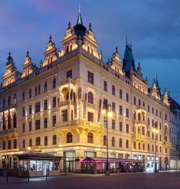 Hotel KINGS COURT on Republic Square, Prague, lit at dusk, venue of the Global Future of BPO, Shared Services & GBS Conference 2027